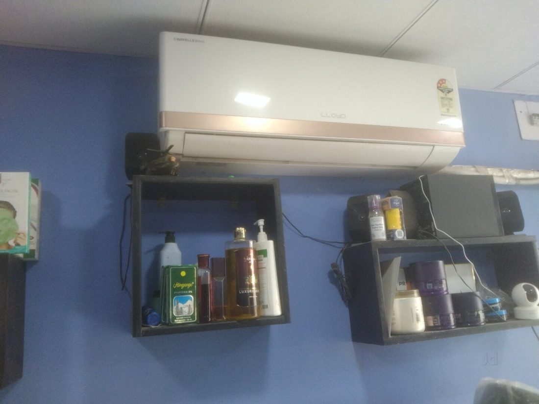Inside Dwarkesh salon: styling station with products